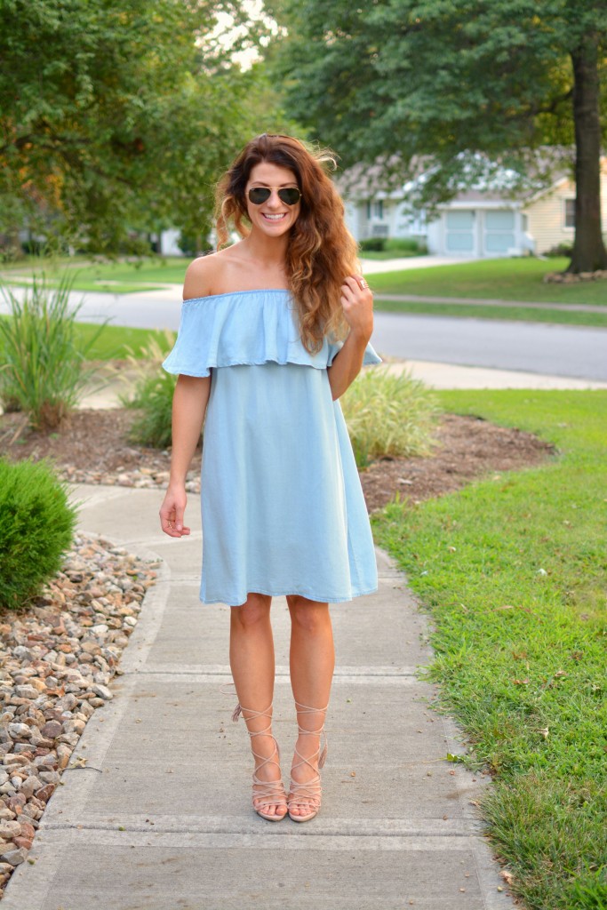 ashley from lsr in a blue ruffled chambray dress, lace up sandals