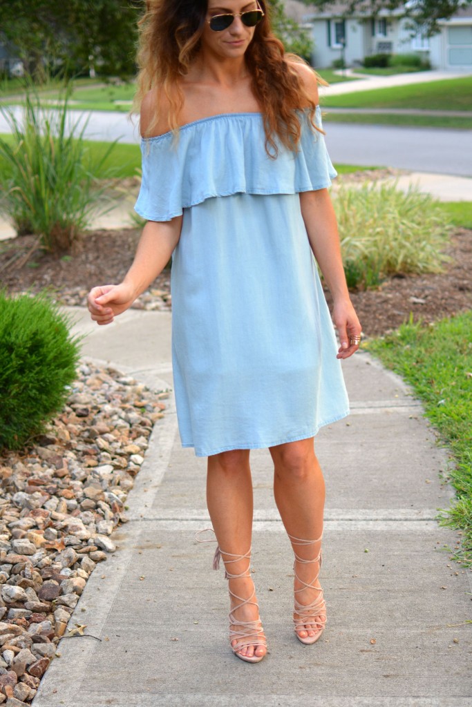 ashley from lsr in a blue ruffled chambray dress, lace up sandals