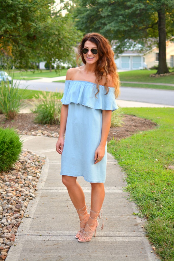 ashley from lsr in a blue ruffled chambray dress, lace up sandals