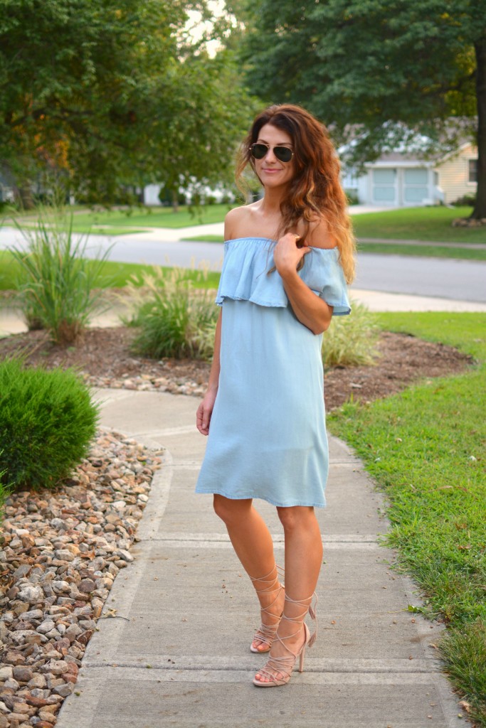 ashley from lsr in a blue ruffled chambray dress, lace up sandals