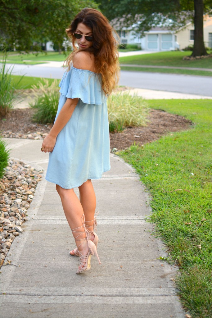 ashley from lsr in a blue ruffled chambray dress, lace up sandals