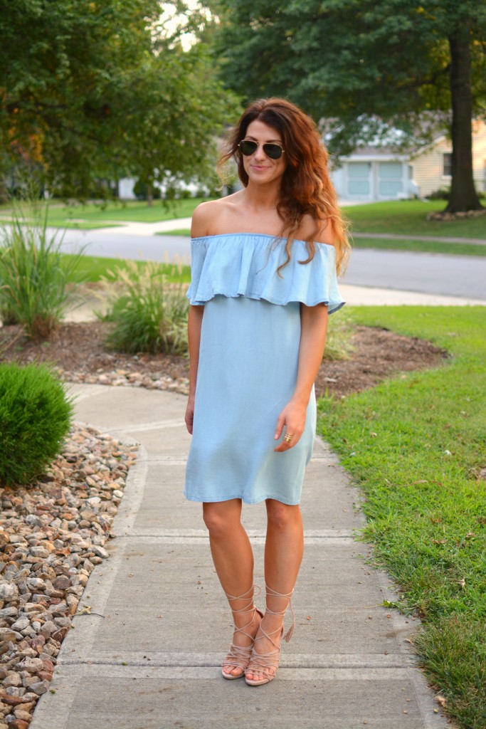 ashley from lsr in a blue ruffled chambray dress, lace up sandals