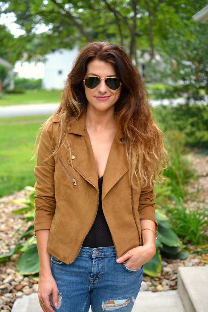 ashley from lsr in a faux suede jacket and a sheer bodysuit