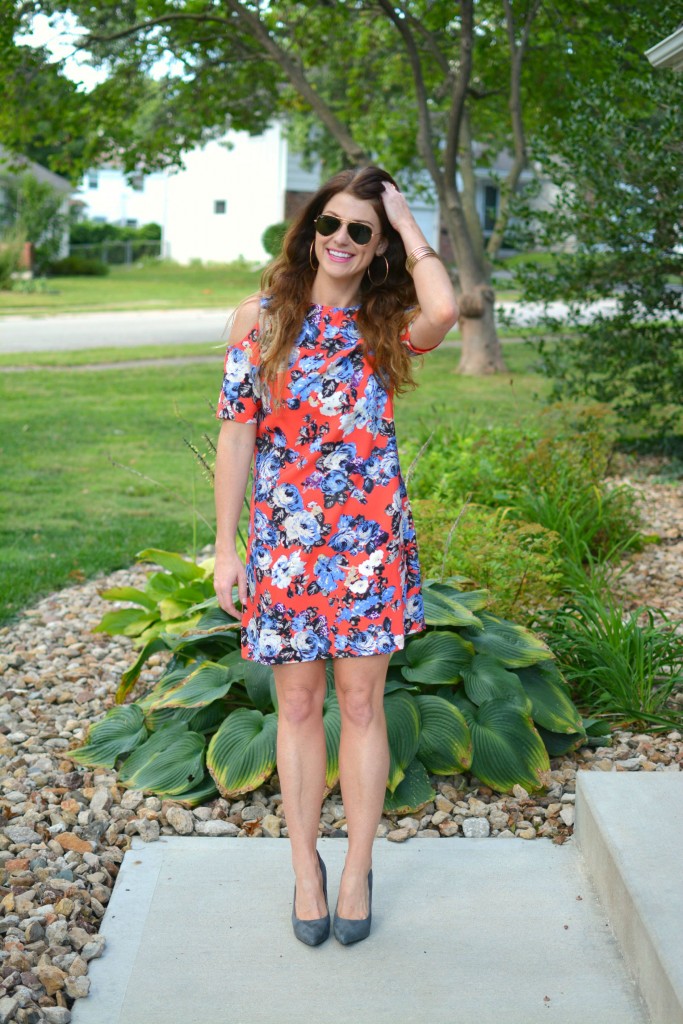 ashley from lsr in a coral floral dress and gray suede pumps