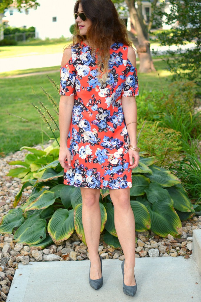 ashley from lsr in a coral floral dress and gray suede pumps