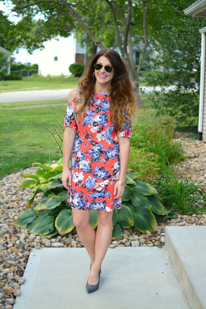 ashley from lsr in a coral floral dress and gray suede pumps