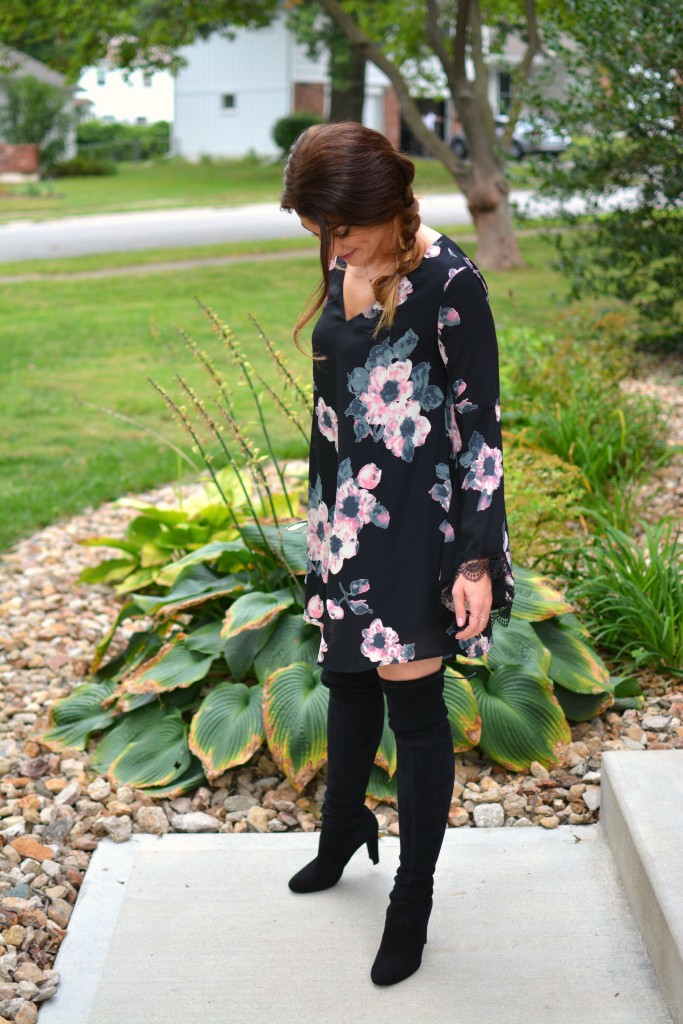 Ashley from LSR in a floral dress and Stuart Weitzman Highland boots