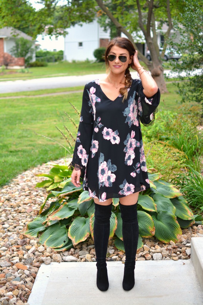 Ashley from LSR in a floral dress and Stuart Weitzman Highland boots