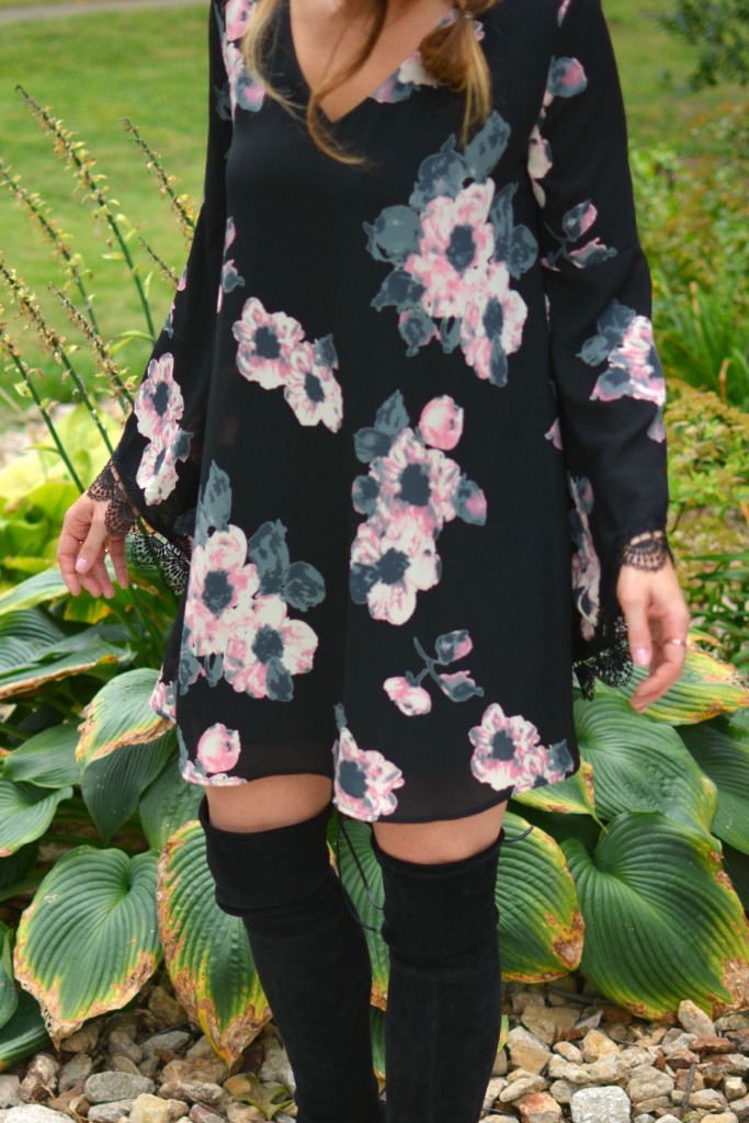 Ashley from LSR in a floral dress and Stuart Weitzman Highland boots