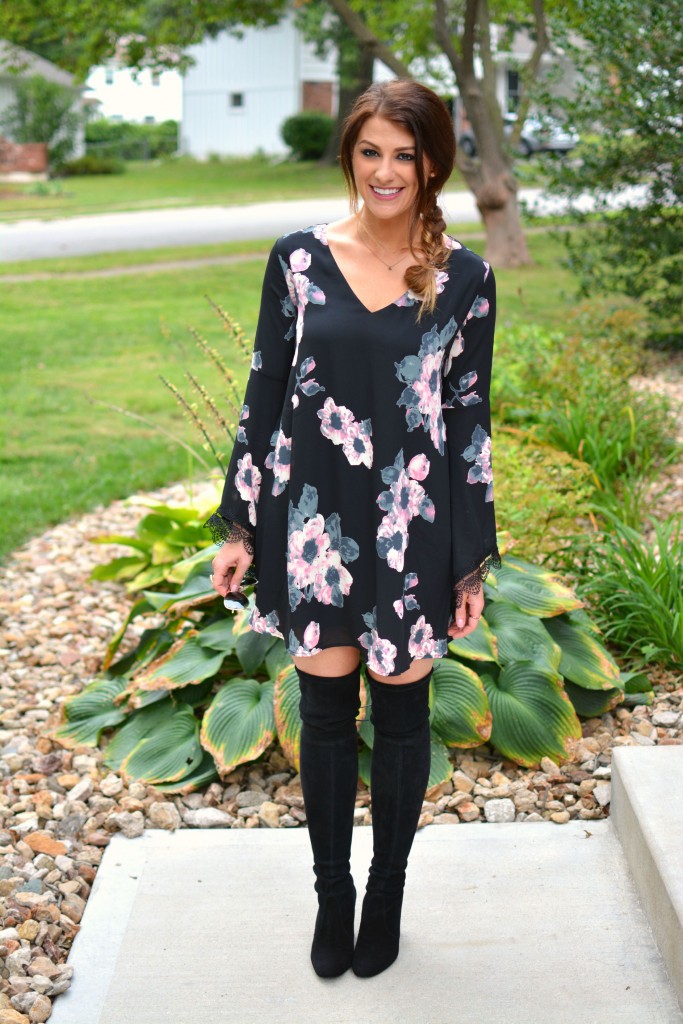 Ashley from LSR in a floral dress and Stuart Weitzman Highland boots