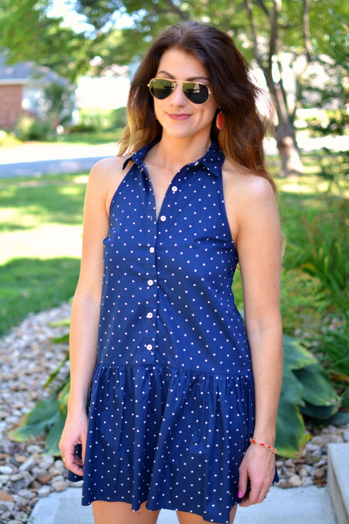 ashley from lsr in a navy polka dot dress, kendra scott elle earrings and jana bracelet