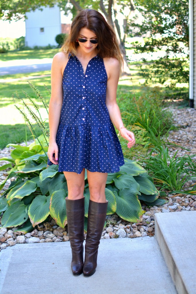 ashley from lsr in a navy polka dot dress, kendra scott elle earrings and jana bracelet, and michael kors boots