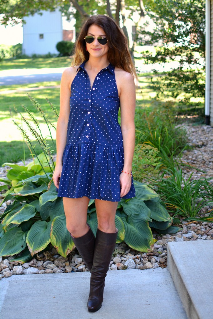 ashley from lsr in a navy polka dot dress, kendra scott elle earrings and jana bracelet, and michael kors boots