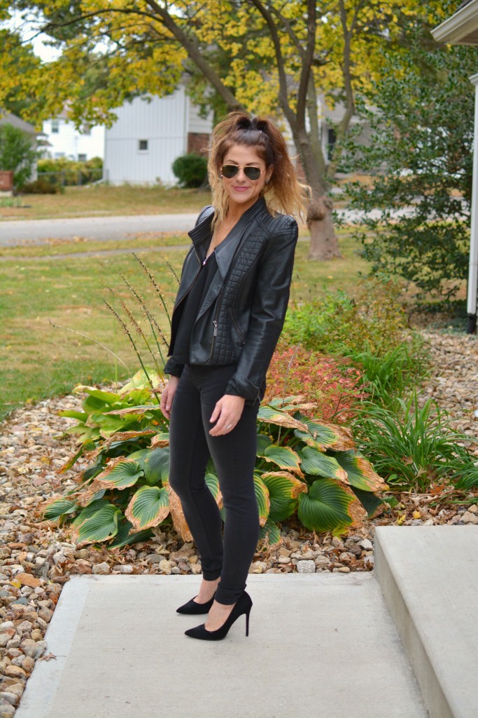 Ashley from LSR in a black leather jacket and black jeans with black suede pumps