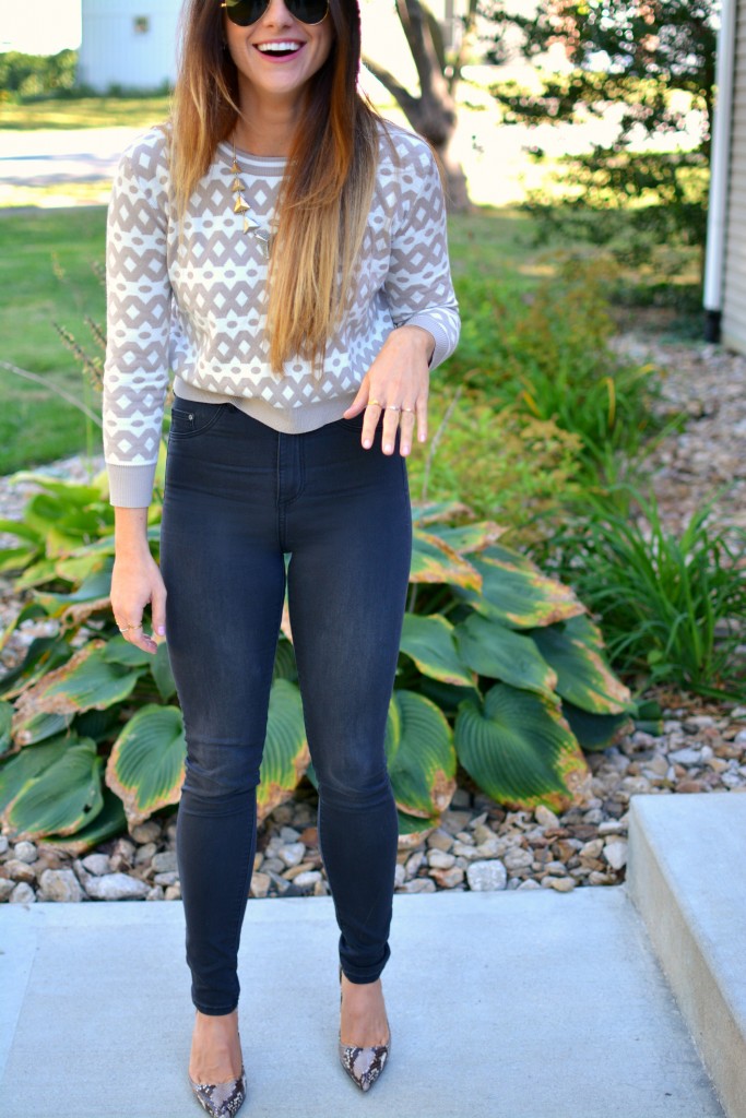 Ashley from LSR in high-waisted black H&M jeggings, cropped printed sweater, and snake skin pumps