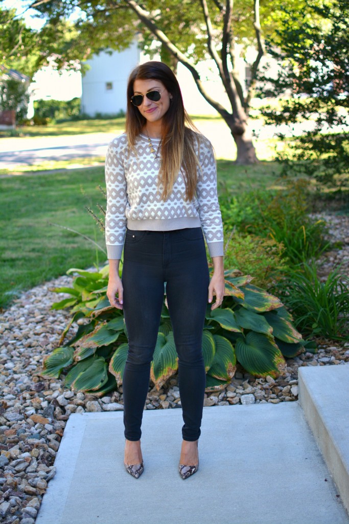 Ashley from LSR in high-waisted black H&M jeggings, cropped printed sweater, and snake skin pumps