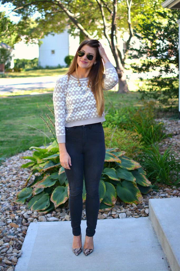 Ashley from LSR in high-waisted black H&M jeggings, cropped printed sweater, and snake skin pumps