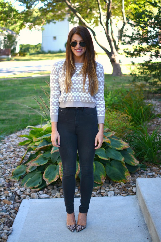 Ashley from LSR in high-waisted black H&M jeggings, cropped printed sweater, and snake skin pumps