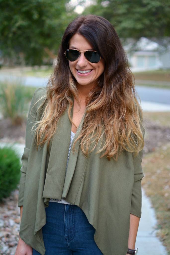 Ashley from LSR in an olive green jacket and Ray-Ban aviator sunglasses.