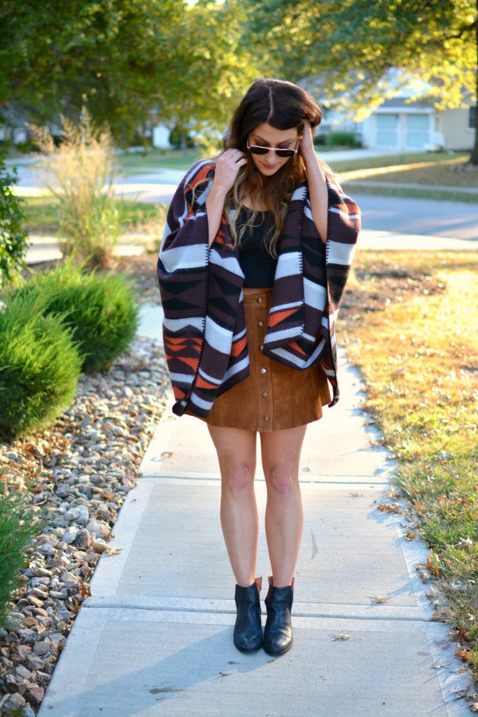 Ashley from LSR in an Old Navy poncho, tan suede skirt, and Jeffrey Campbell booties.