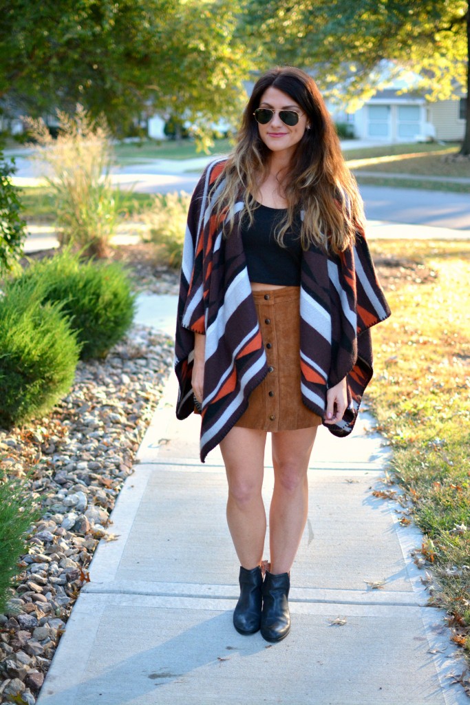 Ashley from LSR in an Old Navy poncho, tan suede skirt, and Jeffrey Campbell booties.