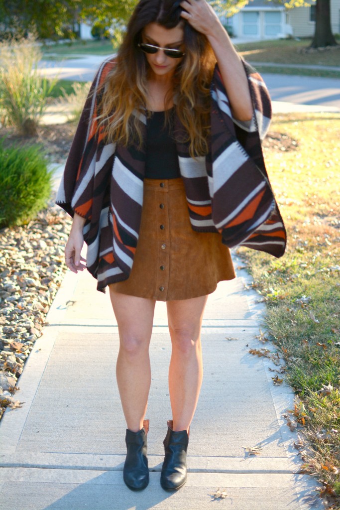 Ashley from LSR in an Old Navy poncho, tan suede skirt, and Jeffrey Campbell booties.