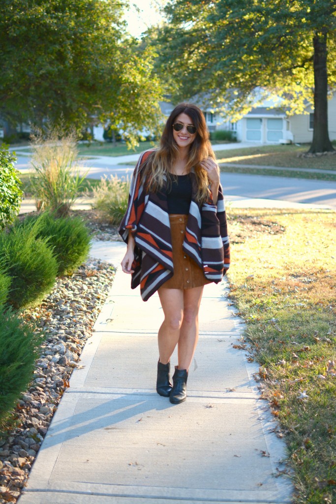 Ashley from LSR in an Old Navy poncho, tan suede skirt, and Jeffrey Campbell booties.