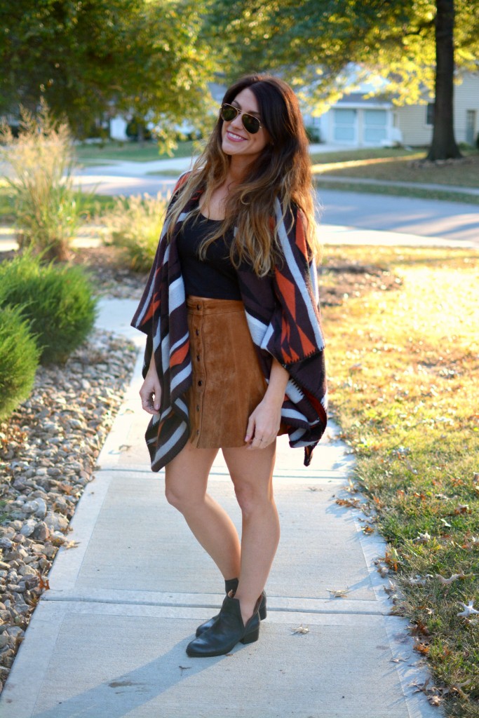 Ashley from LSR in an Old Navy poncho, tan suede skirt, and Jeffrey Campbell booties.