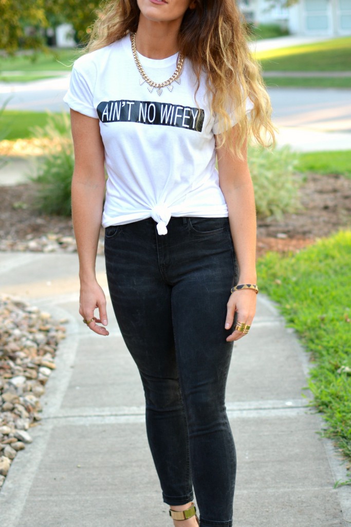 Ashley from LSR in an Ain't No Wifey tee, Madewell jeans, and Topshop sandals.