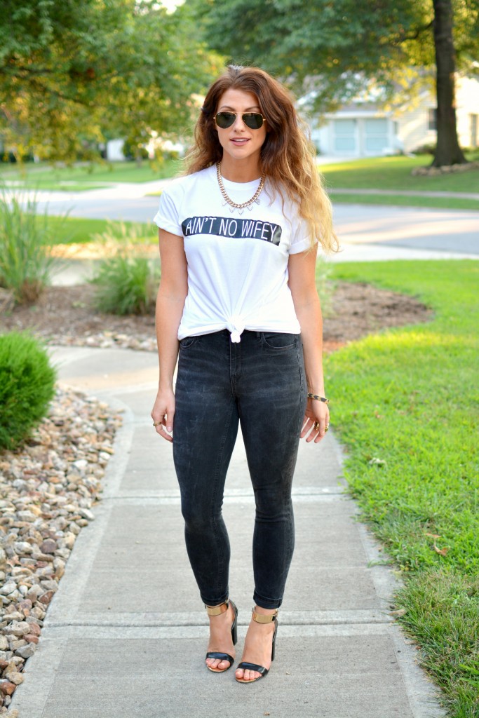 Ashley from LSR in an Ain't No Wifey tee, Madewell jeans, and Topshop sandals.