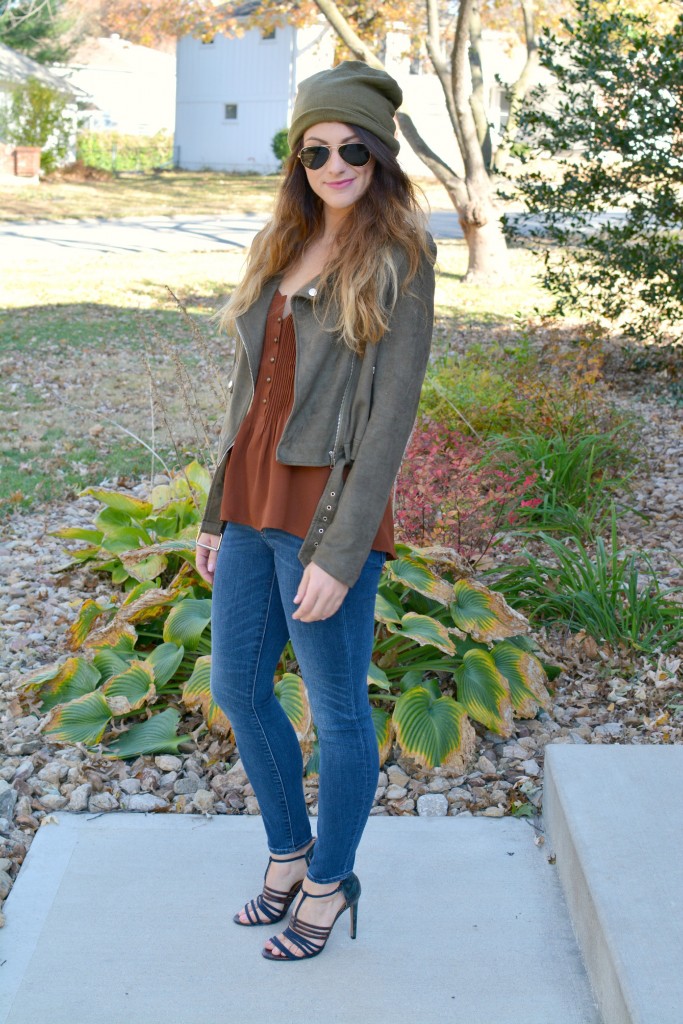 Ashley from LSR in an olive green beanie, olive green suede motorcycle jacket, an Express tank, and Gap jeans.