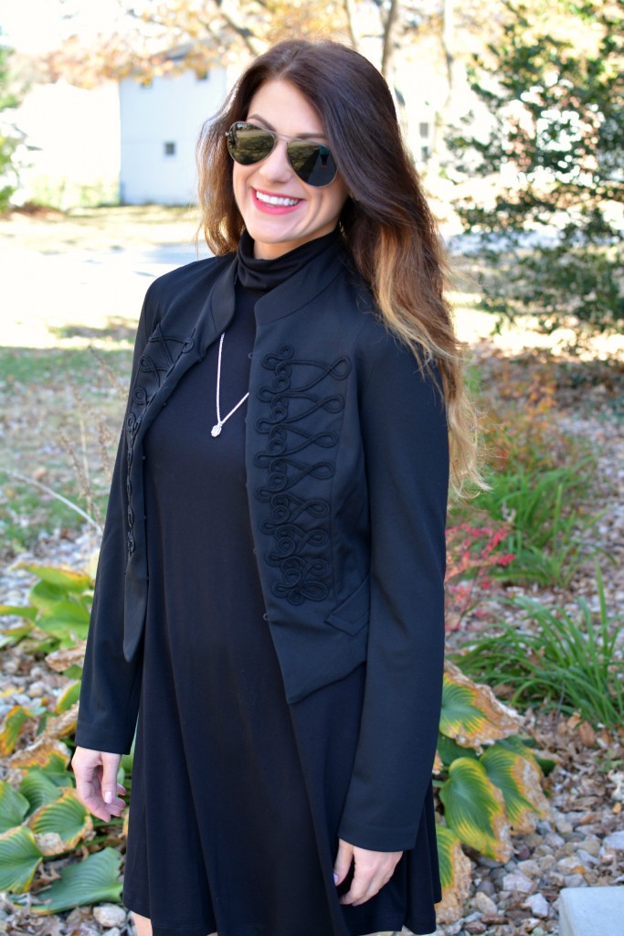 Ashley from LSR in a black turtleneck dress, black jacket, and Kendra Scott necklace.