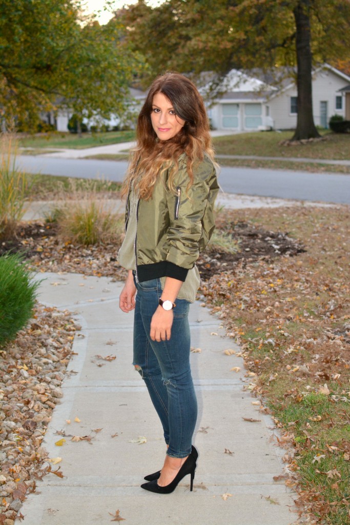 Ashley from LSR in an olive green bomber jacket, Sincerely Jules jeans, and black pumps.