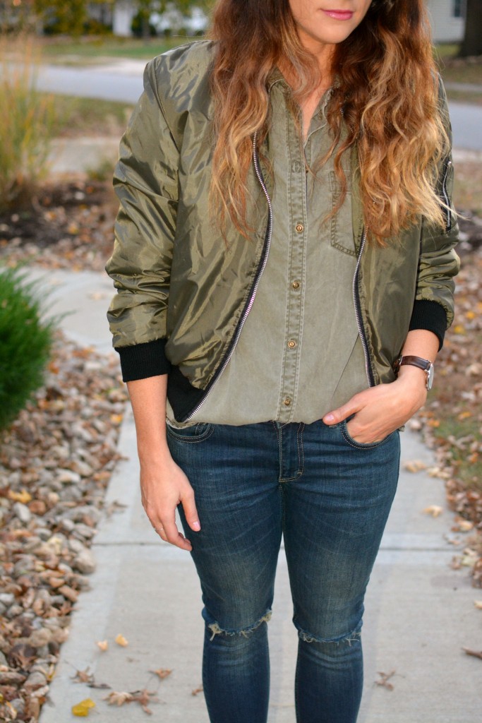 Ashley from LSR in an olive green bomber jacket and Express shirt, and Sincerely Jules jeans.