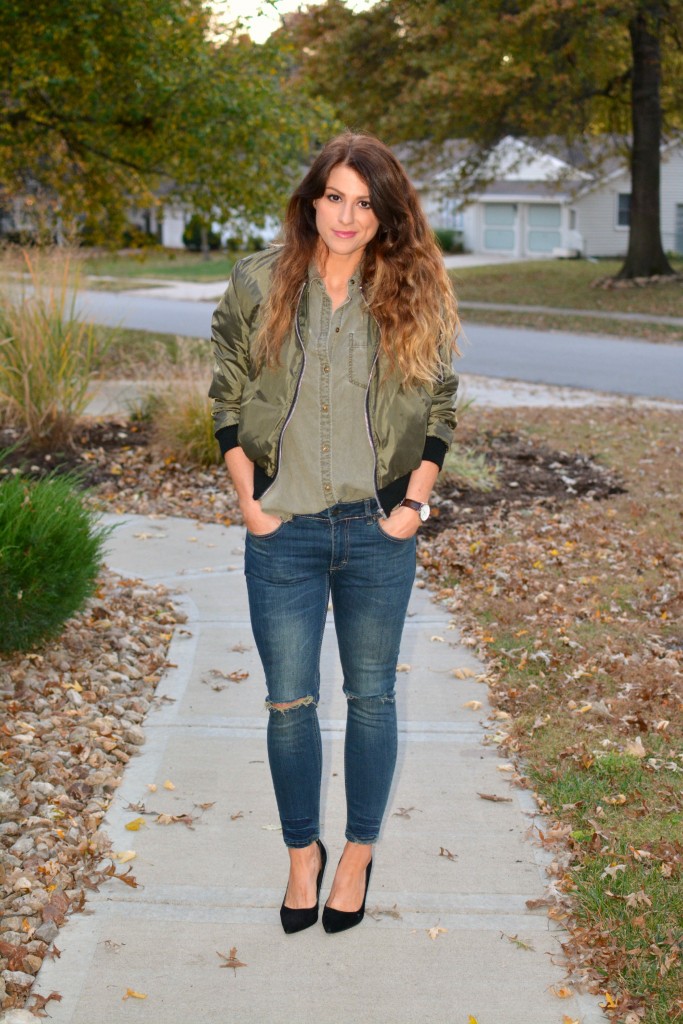 Ashley from LSR in an olive green bomber jacket, Sincerely Jules jeans, and black pumps.