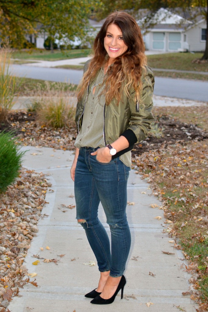 Ashley from LSR in an olive green bomber jacket, Sincerely Jules jeans, and black pumps.