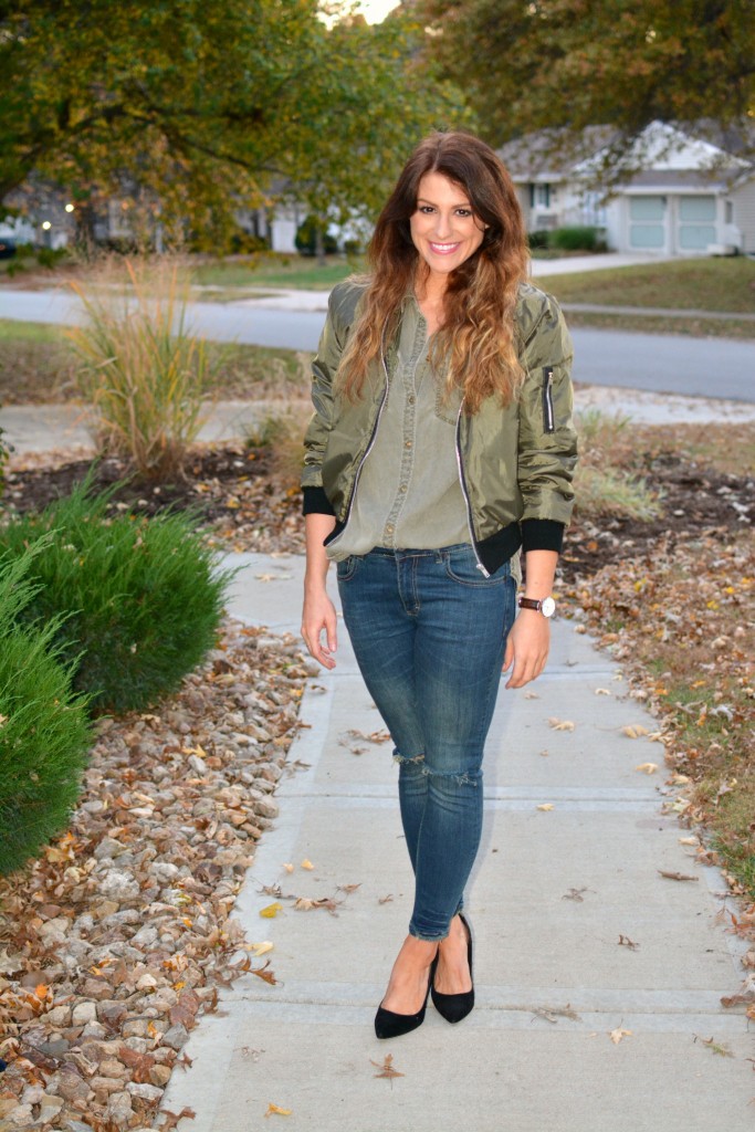 Ashley from LSR in an olive green bomber jacket, Sincerely Jules jeans, and black pumps.