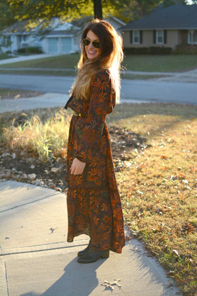 Ashley from LSR in an H&M floral maxi dress, double buckle western belt, and black flat boots.