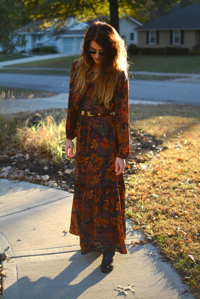 Ashley from LSR in an H&M floral maxi dress, double buckle western belt, and black flat boots.