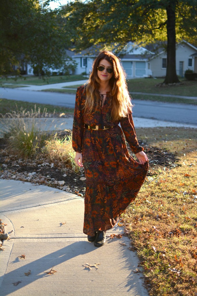 Ashley from LSR in an H&M floral maxi dress, double buckle western belt, and black flat boots.