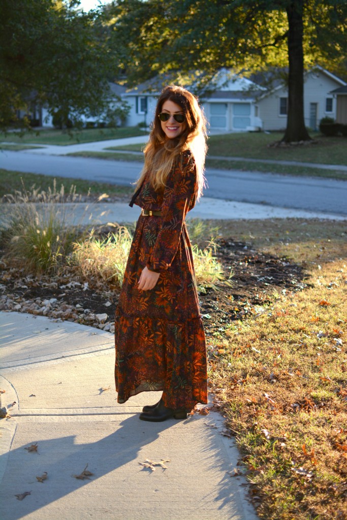 Ashley from LSR in an H&M floral maxi dress, double buckle western belt, and black flat boots.