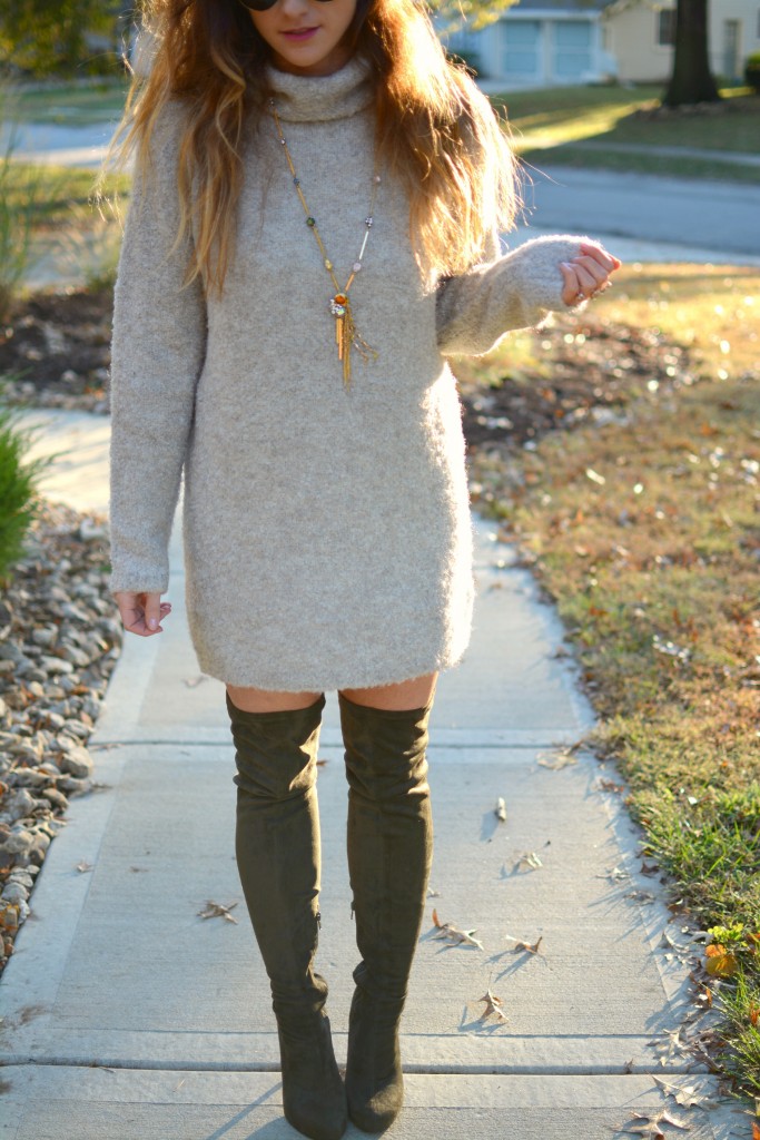 Ashley from LSR in a slouchy beige sweater and olive green over the knee boots.