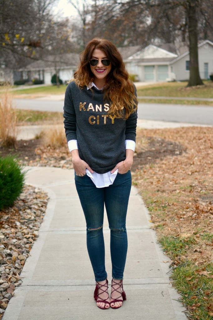 Ashley from LSR in a LocalE sweatshirt, Sincerely Jules jeans, and burgundy suede tassel sandals