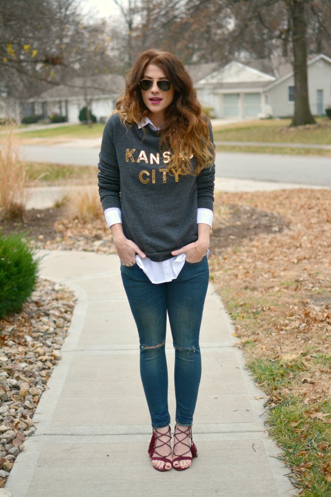 Ashley from LSR in a LocalE sweatshirt, Sincerely Jules jeans, and burgundy suede tassel sandals