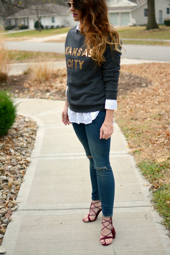 Ashley from LSR in a LocalE sweatshirt, Sincerely Jules jeans, and burgundy suede tassel sandals