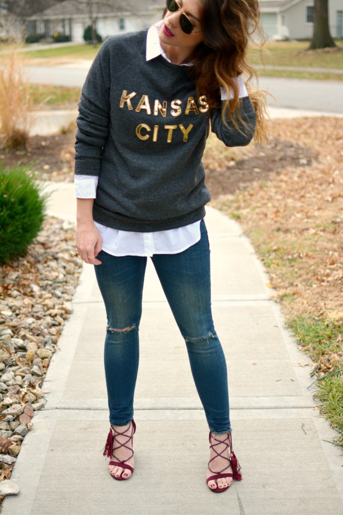 Ashley from LSR in a LocalE sweatshirt, Sincerely Jules jeans, and burgundy suede tassel sandals