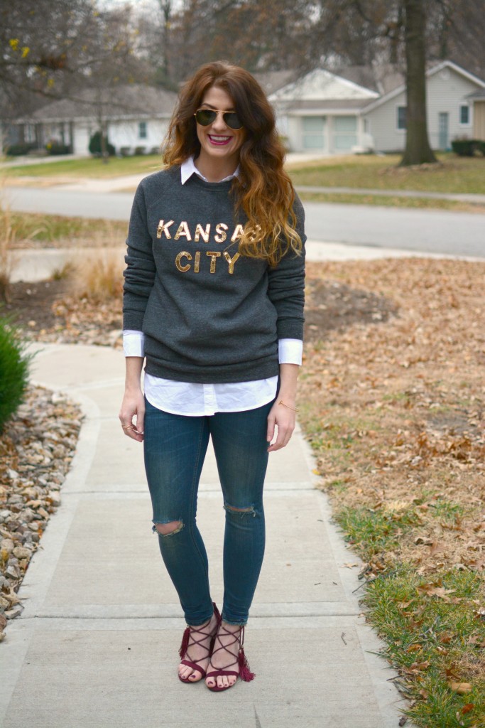 Ashley from LSR in a LocalE sweatshirt, Sincerely Jules jeans, and burgundy suede tassel sandals