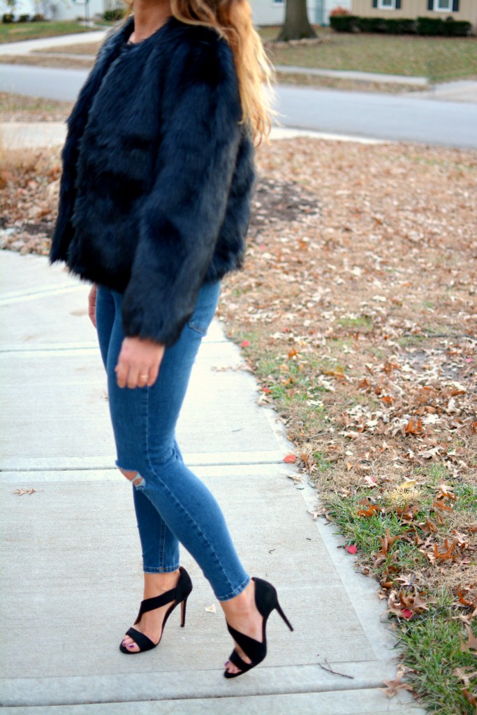 Ashley from LSR in a navy faux fur coat and heels from H&M.
