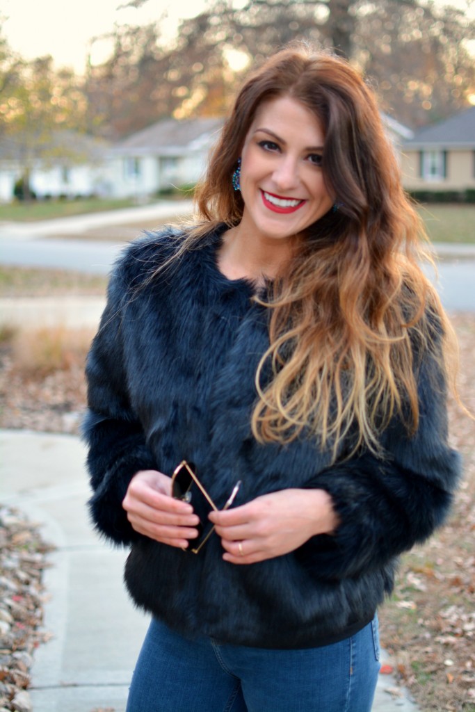 Ashley from LSR in a navy faux fur coat.
