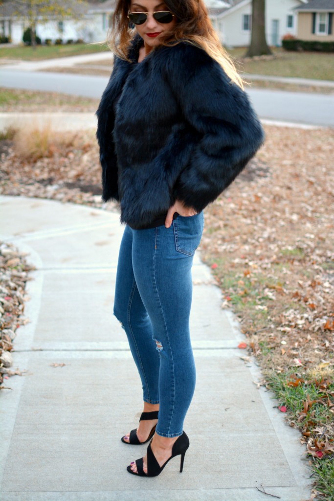 Ashley from LSR in a navy faux fur coat and heels from H&M.